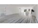 Bright living room with hardwood floors, open floor plan, and lots of natural light at 6732 Sw 132Nd St, Ocala, FL 34473