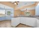 Kitchen with white cabinets, granite counters, and a breakfast bar at 6749 Crescent Ridge Rd, Orlando, FL 32810