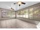 Bright sunroom with tiled floors and multiple windows at 6749 Crescent Ridge Rd, Orlando, FL 32810