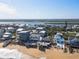 An aerial view reveals the coastal community and highlights the property's proximity to both the ocean and the bay at 6877 S Atlantic Ave, New Smyrna Beach, FL 32169