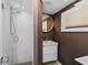 Modern bathroom featuring tile floors, marble shower, and modern vanity at 6877 S Atlantic Ave, New Smyrna Beach, FL 32169