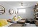 Shared bedroom featuring 3 beds, modern decor, and floating bookshelves at 6877 S Atlantic Ave, New Smyrna Beach, FL 32169