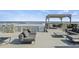 A beautifully furnished deck perfect for outdoor relaxation, featuring comfortable seating and stunning ocean views at 6877 S Atlantic Ave, New Smyrna Beach, FL 32169