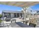 Expansive deck area with modern lounge furniture, providing ample space for relaxation and enjoying the outdoor setting at 6877 S Atlantic Ave, New Smyrna Beach, FL 32169