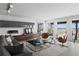 A stylish living room with comfortable seating, ocean views, and a modern entertainment center at 6877 S Atlantic Ave, New Smyrna Beach, FL 32169