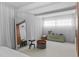 Bright bedroom featuring tile floors, curtains, and modern decor at 6877 S Atlantic Ave, New Smyrna Beach, FL 32169