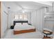 Clean, bright main bedroom with neutral tones, curtains, and walk-in closet at 6877 S Atlantic Ave, New Smyrna Beach, FL 32169