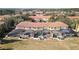 Aerial view showcasing townhouses, each with a private screened pool at 8543 Bay Lilly Loop, Kissimmee, FL 34747