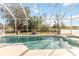 Screened pool with spa and tranquil view at 906 Reserve Pl, Davenport, FL 33896