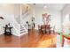 Elegant staircase with white railings and hardwood floors at 906 Reserve Pl, Davenport, FL 33896