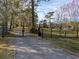 Private gated entrance with long driveway at 9430 Kilgore Rd, Orlando, FL 32836