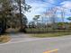 Landscaped front yard with long driveway, leading to a charming two-story home at 9430 Kilgore Rd, Orlando, FL 32836