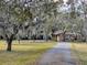 Two-story house exterior with stone accents and a long driveway at 9430 Kilgore Rd, Orlando, FL 32836