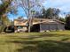 Two-story home with a large screened porch at 9430 Kilgore Rd, Orlando, FL 32836