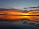 Spectacular sunset over calm lake waters at 9430 Kilgore Rd, Orlando, FL 32836