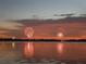 Evening fireworks reflecting on tranquil lake at 9430 Kilgore Rd, Orlando, FL 32836