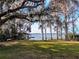 Serene waterfront view with lush trees and private dock at 9430 Kilgore Rd, Orlando, FL 32836