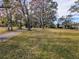 A paved pathway winds through a grassy area with mature trees at 9430 Kilgore Rd, Orlando, FL 32836