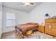Well-lit bedroom with wood laminate flooring and a vaulted ceiling at 9716 Pecky Cypress Way, Orlando, FL 32836