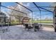 Covered patio with beautiful backyard views, outdoor seating, and workout equipment at 9716 Pecky Cypress Way, Orlando, FL 32836