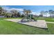 Community playground in a well-maintained park with slides, swings, and a sandpit at 9716 Pecky Cypress Way, Orlando, FL 32836