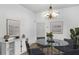 Elegant dining room with glass table and chandelier at 1020 Southern Oak Ln, Apopka, FL 32712