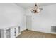 Bright dining room features hardwood floors and a chandelier at 1020 Southern Oak Ln, Apopka, FL 32712