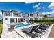 Luxury home with a stunning pool, spa, fire pit, and lounge chairs at 1039 Jack Nicklaus Ct, Kissimmee, FL 34747