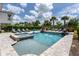 Resort-style pool and spa with a basketball hoop at 1039 Jack Nicklaus Ct, Kissimmee, FL 34747