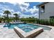 Inviting pool and spa with lounge chairs and palm trees at 1039 Jack Nicklaus Ct, Kissimmee, FL 34747