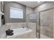 Luxurious bathroom with soaking tub and walk-in shower at 1039 Jack Nicklaus Ct, Kissimmee, FL 34747