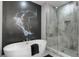 Spa-like bathroom with soaking tub, walk-in shower, and modern fixtures at 1039 Jack Nicklaus Ct, Kissimmee, FL 34747