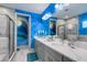 bathroom with fun mural, double vanity, and a walk-in shower at 1039 Jack Nicklaus Ct, Kissimmee, FL 34747