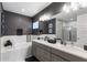 Elegant bathroom with double vanity and soaking tub at 1039 Jack Nicklaus Ct, Kissimmee, FL 34747