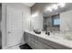Modern bathroom with double vanity and a large walk-in shower at 1039 Jack Nicklaus Ct, Kissimmee, FL 34747