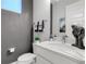 Simple bathroom with single vanity, toilet and modern decor at 1039 Jack Nicklaus Ct, Kissimmee, FL 34747