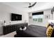 Modern bedroom with large TV and geometric accents at 1039 Jack Nicklaus Ct, Kissimmee, FL 34747
