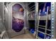 Unique bedroom with bunk beds, space-themed mural, and ladder access at 1039 Jack Nicklaus Ct, Kissimmee, FL 34747