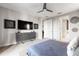 Bright bedroom with large TV and access to bathroom at 1039 Jack Nicklaus Ct, Kissimmee, FL 34747