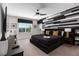 Stylish bedroom with a king-size bed and accent wall at 1039 Jack Nicklaus Ct, Kissimmee, FL 34747