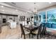 Bright dining room with a large table, chandelier, and view of the backyard at 1039 Jack Nicklaus Ct, Kissimmee, FL 34747