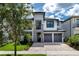 Two-story home with two-car garage and stone accents at 1039 Jack Nicklaus Ct, Kissimmee, FL 34747