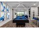 Game room featuring a pool table and a stylish wet bar at 1039 Jack Nicklaus Ct, Kissimmee, FL 34747