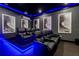 Elegant home theater with reclining seats and ambient lighting at 1039 Jack Nicklaus Ct, Kissimmee, FL 34747