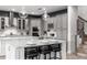 Spacious kitchen with gray cabinets, white island, and stainless steel appliances at 1039 Jack Nicklaus Ct, Kissimmee, FL 34747