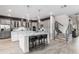 Spacious kitchen with gray cabinets, white island, and stainless steel appliances at 1039 Jack Nicklaus Ct, Kissimmee, FL 34747