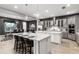 Spacious kitchen with gray cabinets, white island, and stainless steel appliances at 1039 Jack Nicklaus Ct, Kissimmee, FL 34747