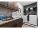 Convenient laundry room with washer, dryer, and built-in cabinets at 1039 Jack Nicklaus Ct, Kissimmee, FL 34747