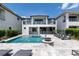 Large, inviting pool with a spa and fire pit area at 1039 Jack Nicklaus Ct, Kissimmee, FL 34747