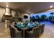 Outdoor kitchen with dining area and pool view at 1039 Jack Nicklaus Ct, Kissimmee, FL 34747